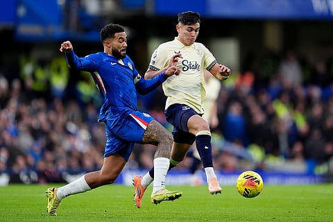 Chelsea's Reece James, left, and Everton's Carlos Alcaraz battle for the ball  during the English Premier League soccer match between Chelsea and Everton in London.