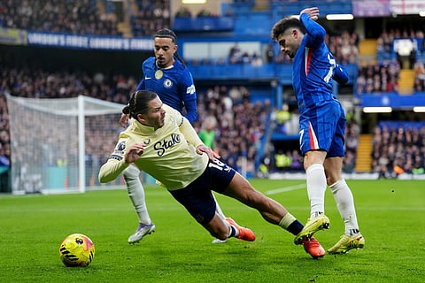 Everton's Jack Grealish, left, is fouled by Chelsea's Pedro Neto during the English Premier League soccer match between Chelsea and Everton in London.