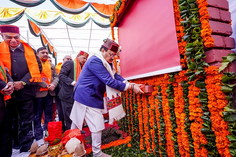 BJP National President and Union Minister JP Nadda, in blue, during the foundation stone laying ceremony of the party's new state office, at Majthai, in Shimla district, Himachal Pradesh, Saturday, Dec. 13, 2025. - PTI