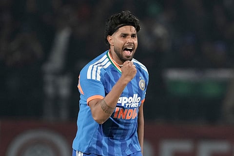 India's Harshit Rana celebrates the wicket of South Africa's Quinton de Kock during the third T20 cricket match between India and South Africa in Dharamshala.