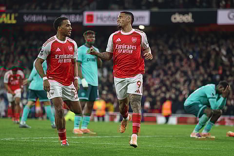 Arsenal's Gabriel Jesus, center, celebrates after scoring his side's second goal during the English Premier League soccer match between Arsenal and Wolves in London.