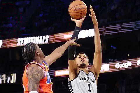 San Antonio Spurs forward Victor Wembanyama (1) shoots the ball near Oklahoma City Thunder guard Jalen Williams (8) in the second half of an NBA Cup semifinals basketball game in Las Vegas. 