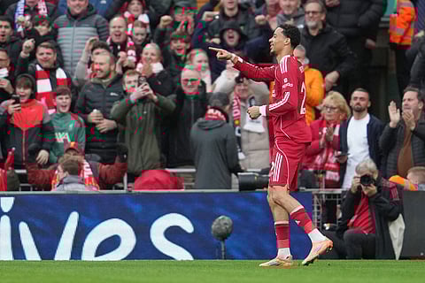 Liverpool's Hugo Ekitike celebrates after scoring his side's opening goal during the English Premier League soccer match between Liverpool and Brighton and Hove Albion in Liverpool, England.