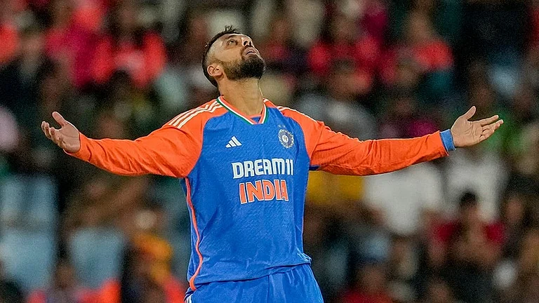 Ind vs SA 3rd T20I: India's Varun Chakravarthy celebrates the dismissal of South Africa's Reeza Hendricks - | Photo: AP/Themba Hadebe