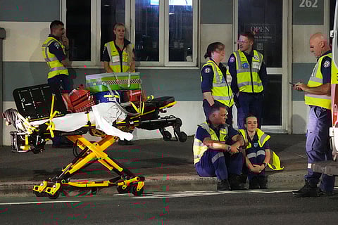 Emergency workers standby at Bondi Beach after a reported shooting in Sydney.