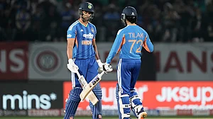 (AP Photo/Ashwini Bhatia) : India's Shivam Dube, left, and Tilak Varma greets each other after India won the match during the third T20 cricket match between India and South Africa in Dharamshala, India, Sunday, Dec. 14, 2025