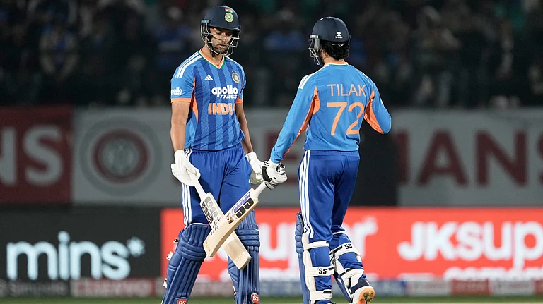 India's Shivam Dube, left, and Tilak Varma greets each other after India won the match during the third T20 cricket match between India and South Africa in Dharamshala, India, Sunday, Dec. 14, 2025 - (AP Photo/Ashwini Bhatia)