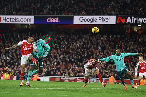 Arsenal's Gabriel Jesus, left, scores his side's second goal during the English Premier League soccer match between Arsenal and Wolves in London.
