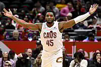 | Photo: AP/John McDonnell : Cleveland Cavaliers guard Donovan Mitchell celebrates after his go-ahead basket late in the second half of an NBA basketball game against the Washington Wizards in Washington. 