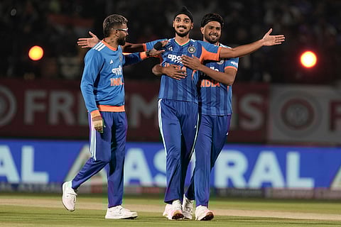 India's Arshdeep Singh, center, celebrates with teammates the wicket of South Africa's Reeza Hendricks during the third T20 cricket match between India and South Africa in Dharamshala.