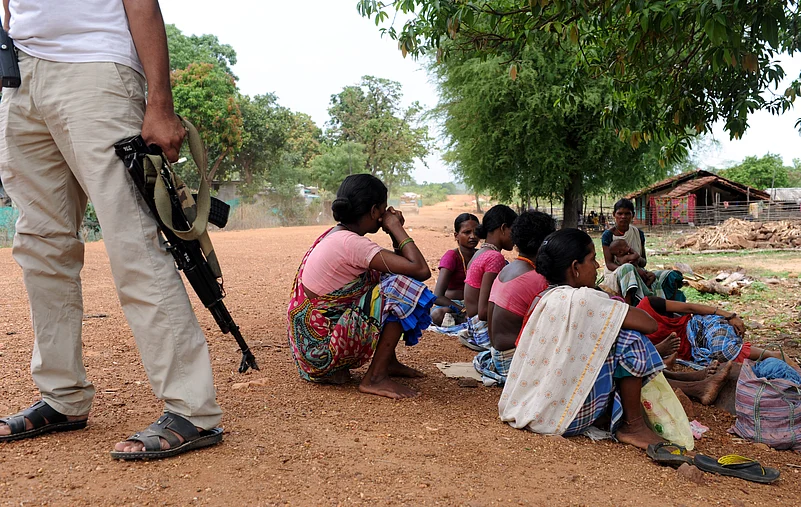 Adivasi land rights, tribal land conflict India, Adivasi displacement development