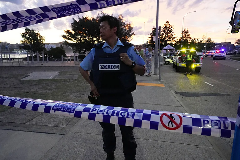 Police cordon off an area at Bondi Beach after a reported shooting in Sydney. - | Photo: AP/Mark Baker