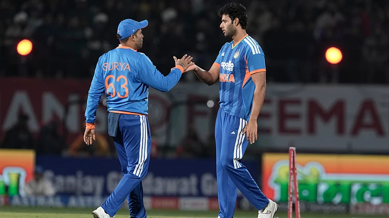 India's captain Suryakumar Yadav, left, and Shivam Dube celebrate the wicket of South Africa's Corbin Bosch during the third T20 cricket match between India and South Africa in Dharamshala, India, Sunday, Dec. 14, 2025 - (AP Photo/Ashwini Bhatia)