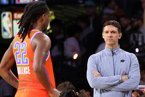 Oklahoma City Thunder head coach Mark Daigneault watches the court in the first half of an NBA Cup semifinals basketball game against the San Antonio Spurs in Las Vegas. 
