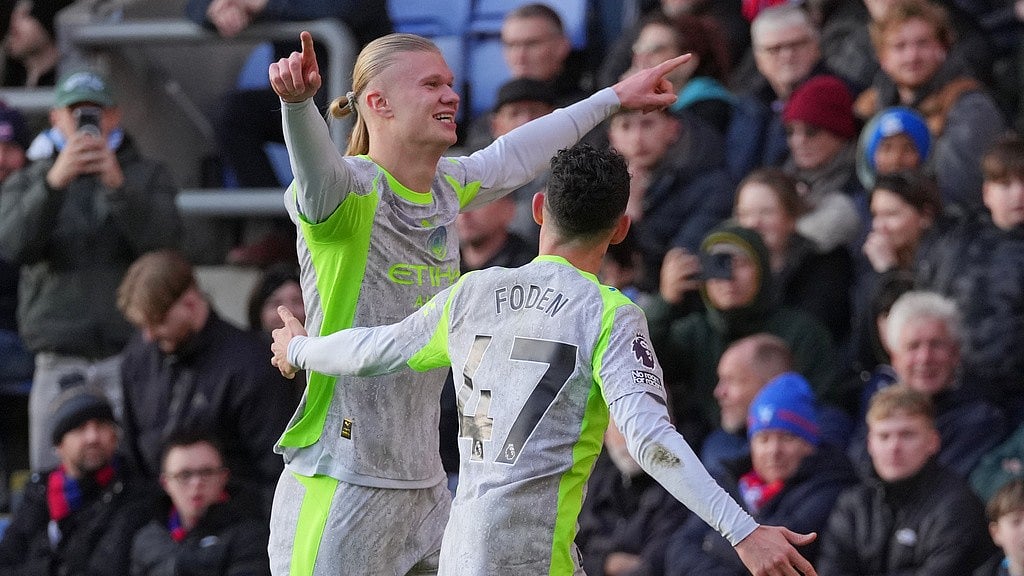 Photo: AP : English Premier League Matchday 16 Live Updates: Manchester City's Erling Haaland celebrates with teammate Phil Foden after scoring his side's opening goal against Crystal Palace.
