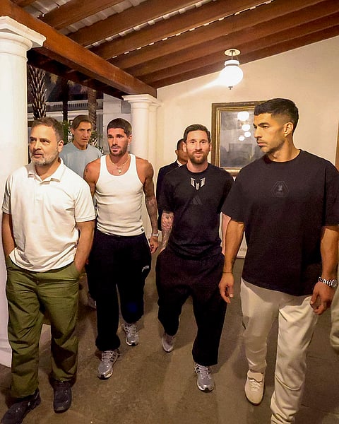 Leader of Opposition in the Lok Sabha Rahul Gandhi with Argentine footballer and 2022 FIFA World Cup winning captain Lionel Messi and his Inter Miami teammates Rodrigo De Paul and Luis Suarez during an event as part of the 'GOAT India Tour 2025', in Hyderabad. 