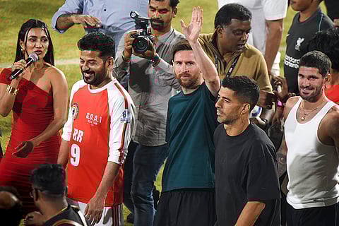Argentine footballer and 2022 FIFA World Cup winning captain Lionel Messi greets fans during an event as part of the second leg of 'GOAT India Tour 2025', in Hyderabad.