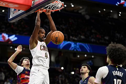 Cleveland Cavaliers center Evan Mobley (4) dunks during the first half of an NBA basketball game against the Washington Wizards in Washington. 