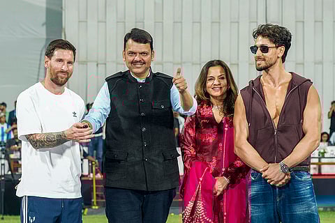 Argentine football superstar Lionel Messi, left, Maharashtra Chief Minister Devendra Fadnavis, second left, Bollywood actor Tiger Shroff, right, and others during an event as part of the 'GOAT India Tour 2025', at the Wankhede Stadium, in Mumbai. 