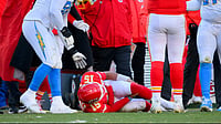 Patrick Mahomes Suffers ACL Tear As Kansas City Chiefs Miss NFL Playoffs | Photo: AP/Reed Hoffmann : Los Angeles Chargers defensive tackle Justin Eboigbe (92) checks on Kansas City Chiefs quarterback Patrick Mahomes (15) as Chiefs head coach Andy Reid, center, looks on after Mahomes was injured during the second half of an NFL football game, Sunday, Dec. 14, 2025 in Kansas City, Mo.