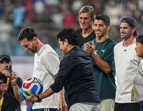 Cricket legend Sachin Tendulkar with Argentine footballer and 2022 FIFA World Cup winning captain Lionel Messi and his Inter Miami teammates Rodrigo De Paul and Luis Suarez during an event as part of the 'GOAT India Tour 2025', at the Wankhede Stadium, in Mumbai.