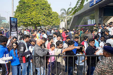 Fans of Argentinian footballer Lionel Messi gather outside Arun Jaitley Stadium ahead of the 'GOAT India Tour 2025' event, in New Delhi.
