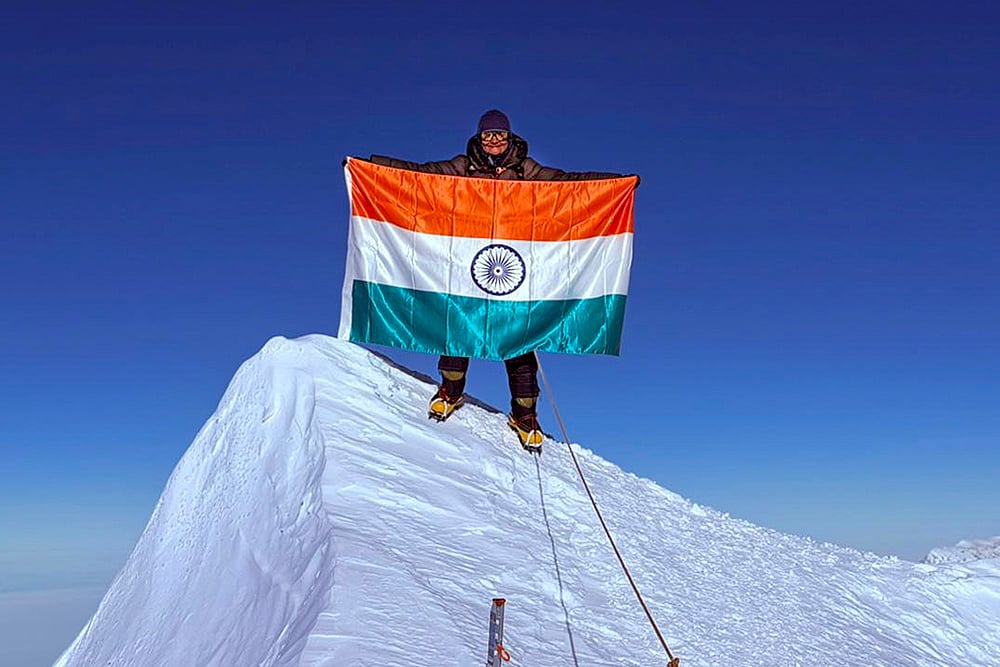 Kavita Chand, a native of Almora in Uttarakhand, poses with the Tricolour after successfully summiting Mount Vinson, the highest peak in Antarctica. - | Photo: PTI