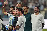 | Photo: PTI/Kunal Patil : Cricket legend Sachin Tendulkar with Argentine footballer and 2022 FIFA World Cup winning captain Lionel Messi and his Inter Miami teammates Rodrigo De Paul and Luis Suarez during an event as part of the 'GOAT India Tour 2025', at the Wankhede Stadium, in Mumbai.