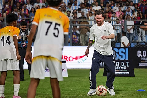 Argentine footballer Lionel Messi kicks a football during the 'GOAT India Tour 2025', at Wankhede Stadium, in Mumbai.