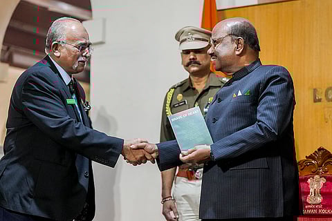 West Bengal Governor CV Ananda Bose felicitates a member of Bangladesh's Mukti Jodhas during an event at Lok Bhavan, in Kolkata.