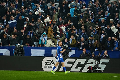 Alaves' Carlos Vicente celebrates after scoring his side's opening goal during the Spanish La Liga soccer match between Alaves and Real Madrid in Vitoria-Gasteiz, Spain.