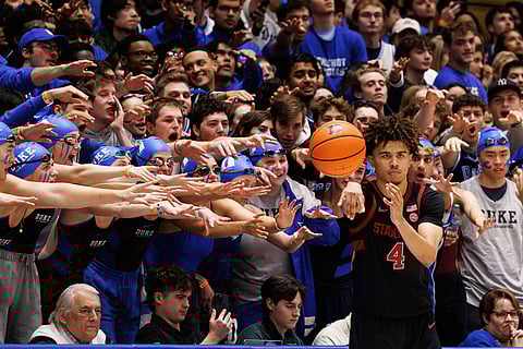 Cameron Crazies student section try to distract Stanford's Oziyah Sellers's as he in-bounds the ball during the second half of an NCAA college basketball game against Duke in Durham, N.C., Feb. 15, 2025. 