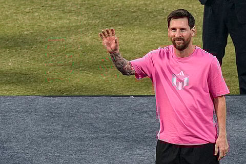 Argentine footballer Lionel Messi greets the gathering during the 'GOAT India Tour 2025', at Arun Jaitley Stadium in New Delhi.