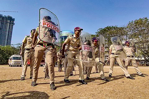 Police officials take part in a mock drill, in Navi Mumbai.