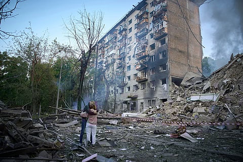 Residents react after a Russian missile hit an apartment building during Russia's combined missile and drone air attack in Kyiv, Ukraine, June 17, 2025. 