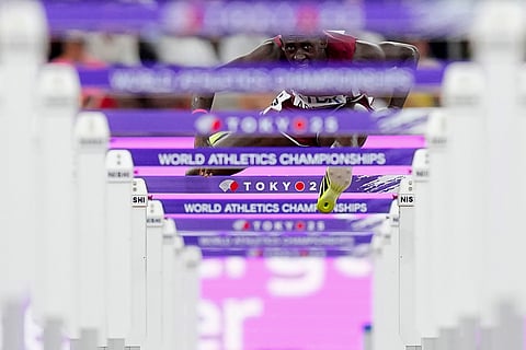 Qatar's Oumar Doudai Abakar competes in a men's 110 meters hurdles heat at the World Athletics Championships in Tokyo, Sept. 15, 2025. 