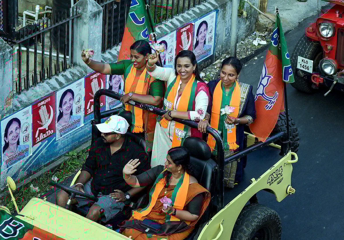 Thiruvananthapuram: NDA's winning candidates of the recent Kerala local body elections greets people during a roadshow, in Thiruvananthapuram - PTI             