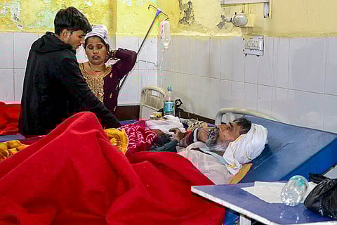 Injured passengers receive treatment at a hospital after a fog-hit pile-up involving buses and cars sparked fires on the Yamuna Expressway, in Mathura.