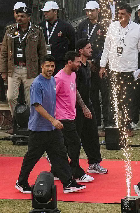 Argentine footballer Lionel Messi, centre, during the final leg of his 'GOAT India Tour 2025', at Arun Jaitley Stadium in New Delhi.