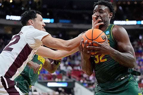 Baylor guard Jalen Celestine (32) is fouled by Mississippi State forward RJ Melendez, left, during the first half in the first round of the NCAA college basketball tournament, March 21, 2025, in Raleigh, North Carolina. 