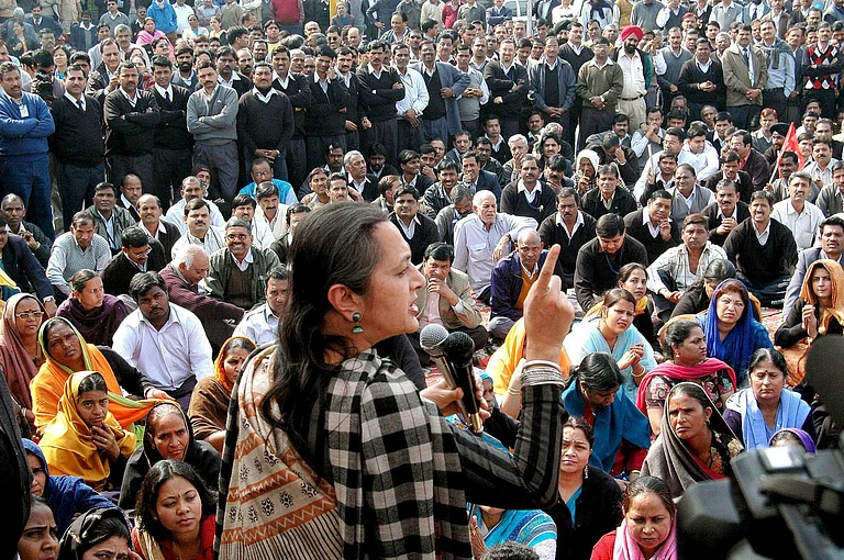 CPM Politburo member and Indian lawmaker BRINDA KARAT addresses striking airport workers at the Indira Gandhi International Airport in New Delhi - IMAGO / ZUMA Press Wire