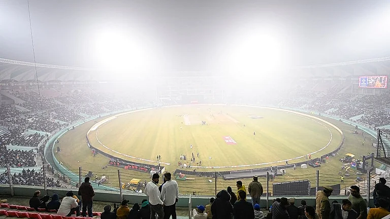 A view of Ekana Cricket Stadium shrouded in dense fog ahead of the fourth T20 International between India and South Africa, in Lucknow. The match was called off due to poor visibility caused by dense layer of smog. - | Photo: PTI/Ravi Choudhary