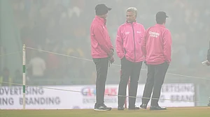 (PTI Photo/Ravi Choudhary) : Lucknow: Umpires interact among themselves amid fog at Ekana Cricket Stadium ahead of the fourth T20 International cricket match of a series between India and South Africa, in Lucknow, Wednesday, Dec. 17, 2025