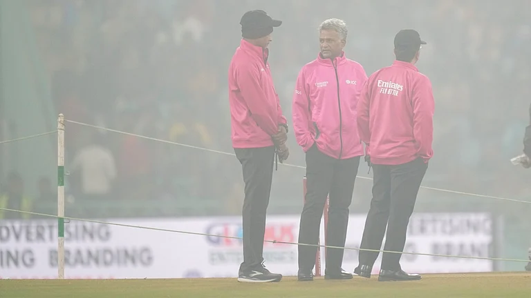 Lucknow: Umpires interact among themselves amid fog at Ekana Cricket Stadium ahead of the fourth T20 International cricket match of a series between India and South Africa, in Lucknow, Wednesday, Dec. 17, 2025 - (PTI Photo/Ravi Choudhary)