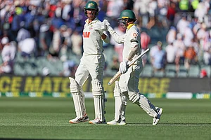 | Photo: AP/James Elsby : Australia's Mitchell Starc, left, and his batting partner Nathan Lyon walk back to the pavilion at the end of day one of the third Ashes cricket Test between England and Australia at the Adelaide Oval in Adelaide, Australia.