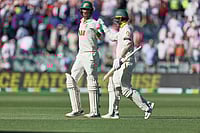 | Photo: AP/James Elsby : Australia's Mitchell Starc, left, and his batting partner Nathan Lyon walk back to the pavilion at the end of day one of the third Ashes cricket Test between England and Australia at the Adelaide Oval in Adelaide, Australia.