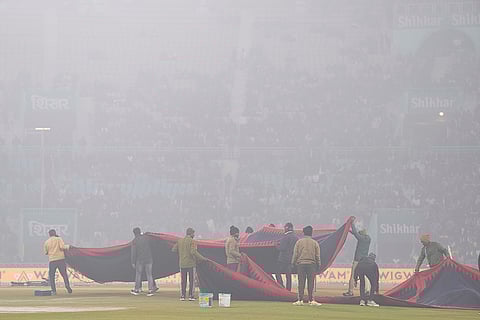 Ground staff members ahead of the fourth T20 International cricket match of a series between India and South Africa, at Ekana Cricket Stadium in Lucknow.