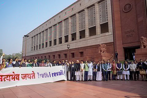 Opposition MPs stage a protest during Parliament's Winter session, in New Delhi.