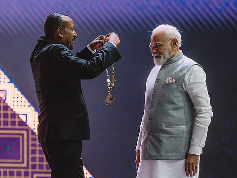 Prime Minister Narendra Modi being conferred with Ethiopia's highest award 'The Great Honour Nishan of Ethiopia' by his Ethiopian counterpart Abiy Ahmed Ali during a ceremony at the Addis International Convention Centre, in Addis Ababa. 