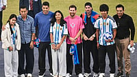GOAT Tour Of India 2025: Messi Thanks India For Hospitality, Backs ‘Bright Future’ For Indian Football | Photo: AP : Lionel Messi and teammates Rodrigo De Paul and Luis Suarez pose with former Indian footballer Bhaichung Bhutia and others during their India tour in New Delhi on December 15, 2025.